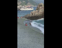 Girl gets knocked over by wave