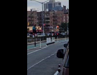 Man ride tall unicycle on the road