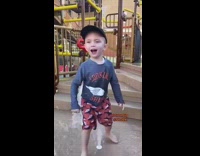 Little boy uses fountain to tickle himself 