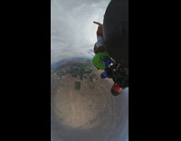 POV of camera on top of helmet of a person skydiving out of plane