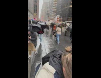 People Struggle Against Windy Rain in NYC