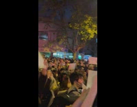 Video of people on street holding white paper up in protest in china