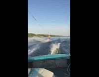 Guy slow mo red shorts wake board fail