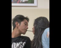Couple share and eat one pocky stick 