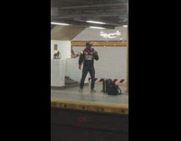 Guy sings George Michael karaoke in subway station