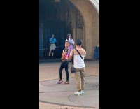 Collab IITW - Person turn around pose front of castle