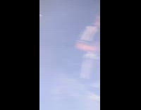 Guy in referee shirt drops green firework