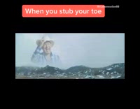 White robe guy stubs toe cowboy sings