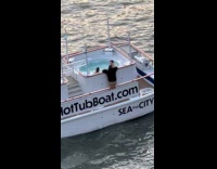 Hot tub boat with couple on jacuzzi 