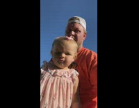 Little baby cusses helping dad weed garden 