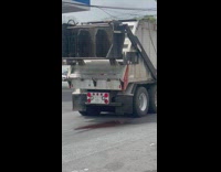 Red liquid leaks from garbage truck 