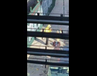 Yellow jacket guy dances headphones train tracks 