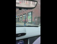 Man with Luggage on Head Rides Bicycle