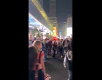 Knicks fans celebrating blocks the garbage truck