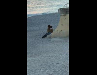 Couple woman in man lap big rock