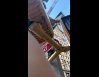 Collab WINY - Woman push traffic light hanged on pole