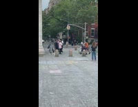 Grandpa dances to guys singing at park 