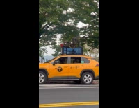 [third party] Man smoke and lay on top of taxi