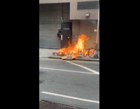 Collab WINY - Man puts out fire from burning boxes street