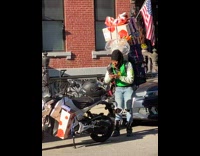 Lady with boxes on back starts dancing