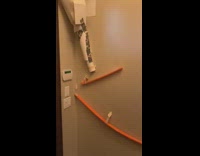 Orange ping pong ball domino effect house 