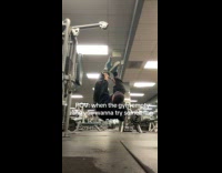 Woman pretends to be spiderman at the gym