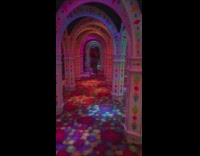 Girl in blue pants running through mirror maze runs into wall