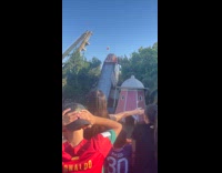 Group of people knocked out by huge splash