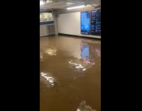 People stranded inside the flooded subway station