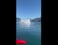 Humpback whale emerges near the filmers boat
