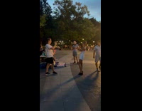 Boyfriend films girlfriend taking pictures 