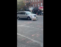 Trash bag in the middle of road