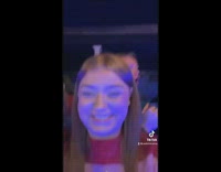 Girl steals christmas hat from guy in club