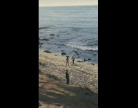 Man white sleeveless top dance on the beach