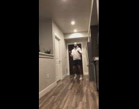 White sweater guy kitchen passes toilet paper 