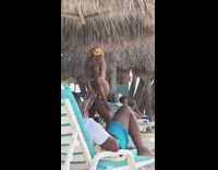 Pregnant woman in orange bikini beach pictorial