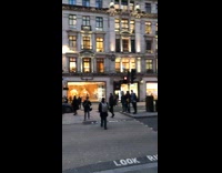 Guy hangs off street lights for photo