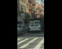 Guy rides bicycle wheelie no front wheel