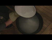 Guy pours water over dry ice bucket