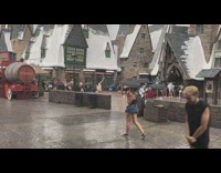 Women swing arms over head rain universal studios