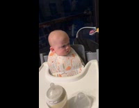 Baby telling off noisy dogs by grunting 