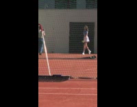 Woman blue top skirt tennis court photoshoot