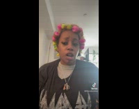 Woman pink and green hair curls