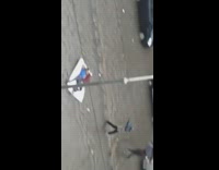Two guys mattress float down flooded road 