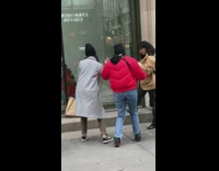 two girls coats storefront tiktok