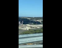 Guy purple shirt takes picture bike laugh