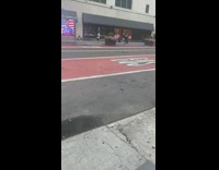 Guy walks barefoot down sidewalk 