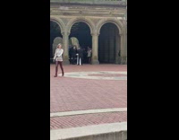 Four women dance group with wedding ceremony behind
