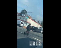 Woman ride E-bike at the stoplight