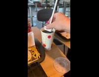 Collab ClipsIG - Man Sets Sauce Packet on Bottom of  Drink